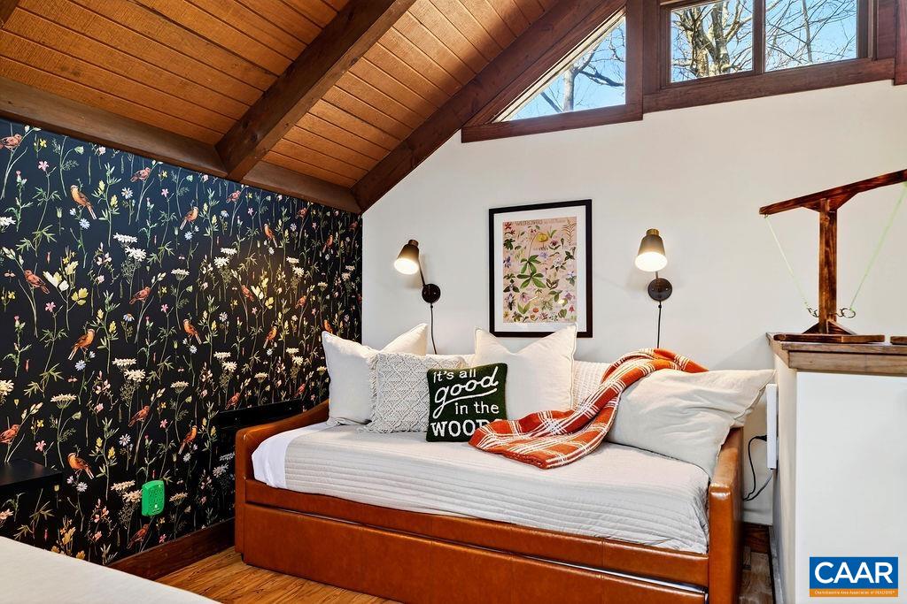 96 Squirrel Tree Lane Roseland, VA 22967 - Photo 29 of 46 a bedroom with a bed and a chandelier