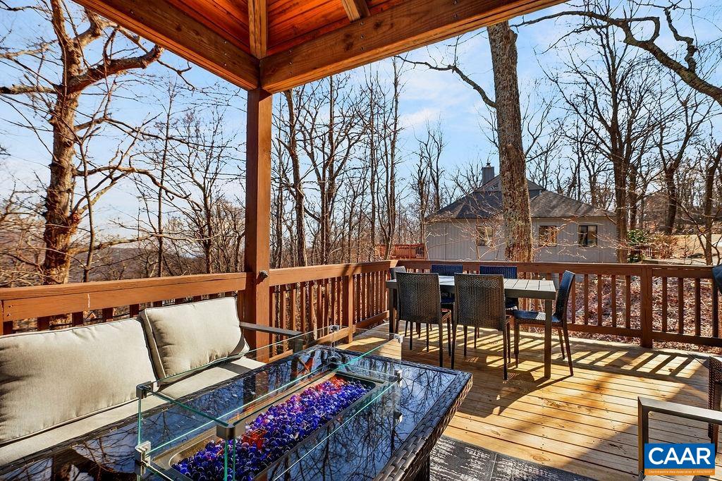 96 Squirrel Tree Lane Roseland, VA 22967 - Photo 33 of 46 a view of a chairs and tables in the patio