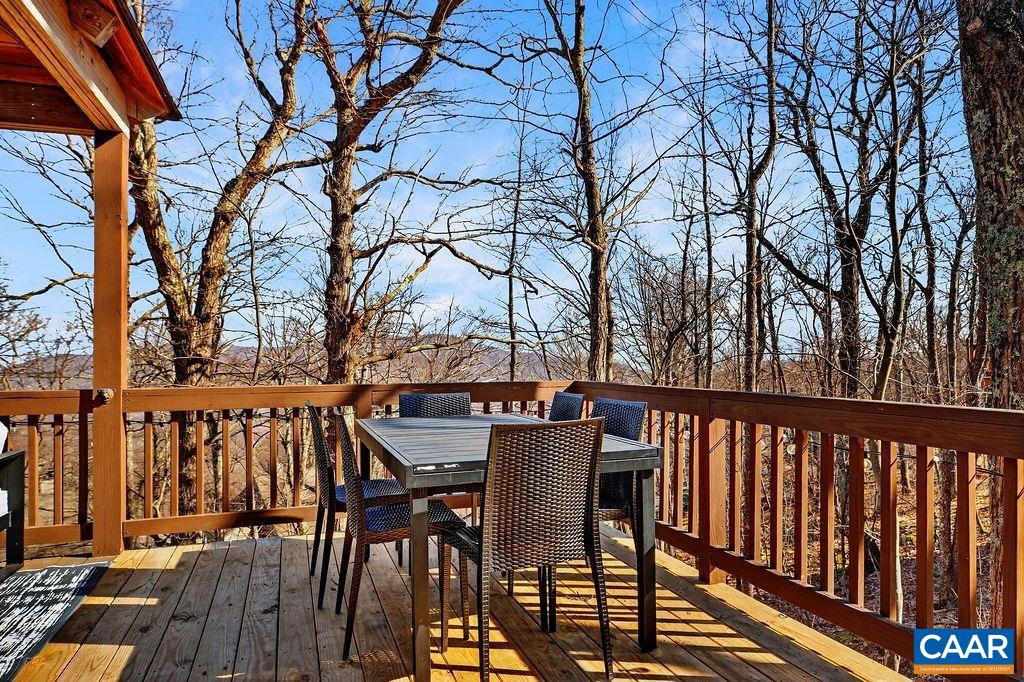 96 Squirrel Tree Lane Roseland, VA 22967 - Photo 34 of 46 a view of a chairs and table on the deck