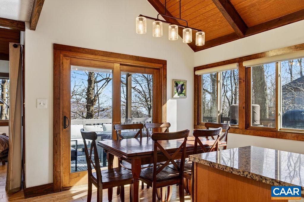 96 Squirrel Tree Lane Roseland, VA 22967 - Photo 10 of 46 a view of a dining room with furniture large windows and wooden floor