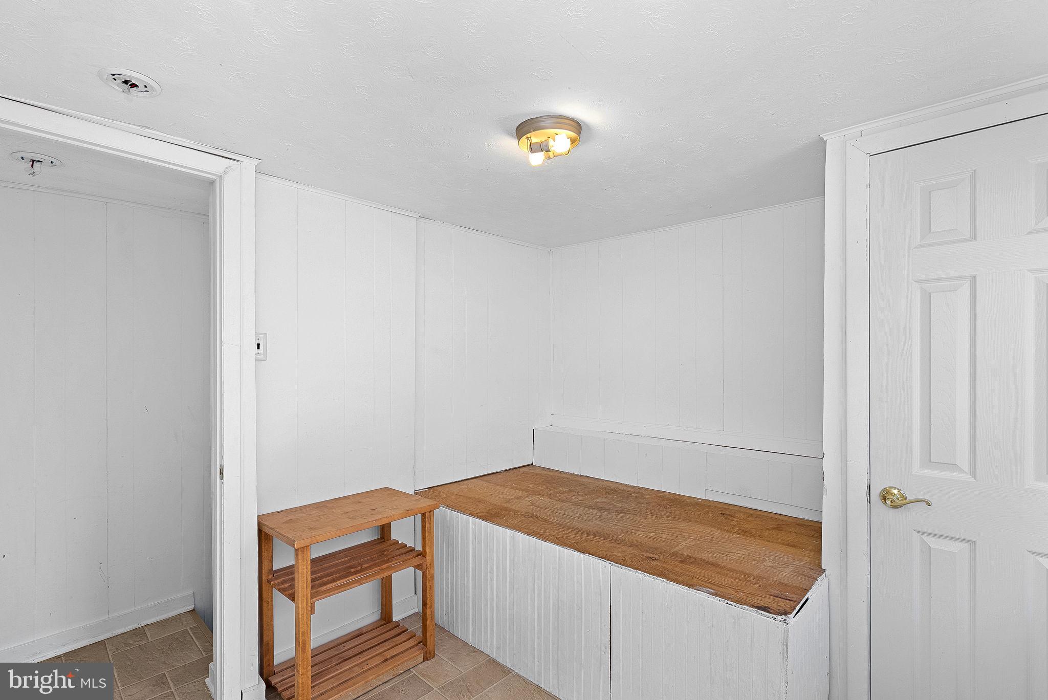 31 Main Street Round Hill, VA 20141 - Photo 17 of 35 a room with a bed and gym equipment