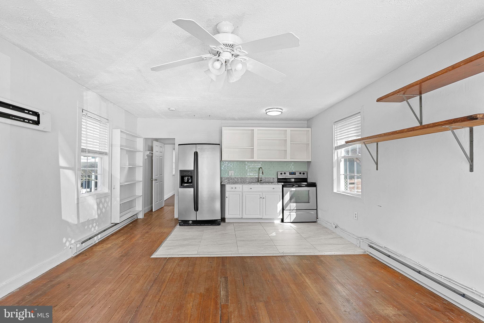 31 Main Street Round Hill, VA 20141 - Photo 23 of 35 a view of a kitchen with wooden floor and a kitchen