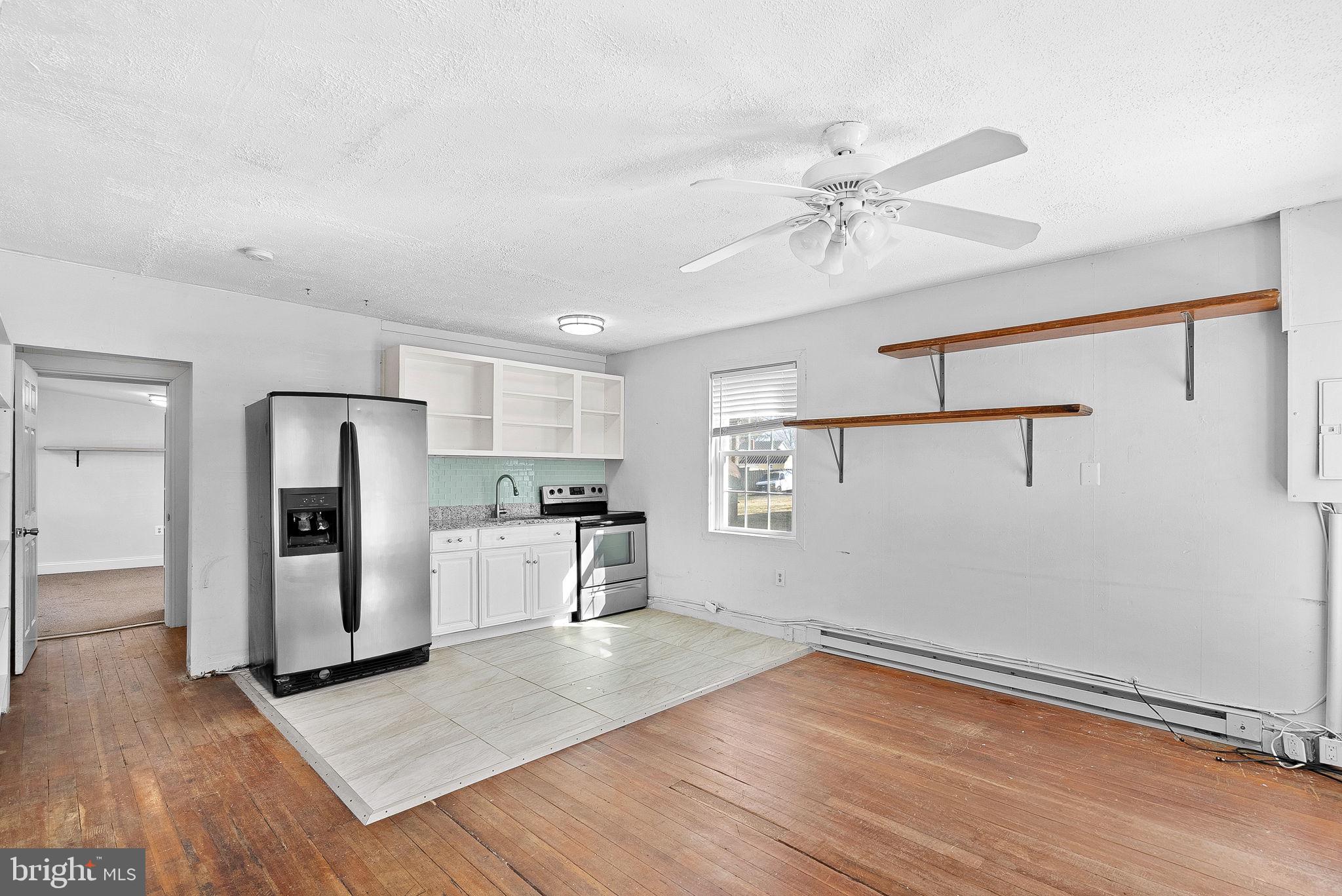 31 Main Street Round Hill, VA 20141 - Photo 24 of 35 a view of a kitchen with a sink and refrigerator