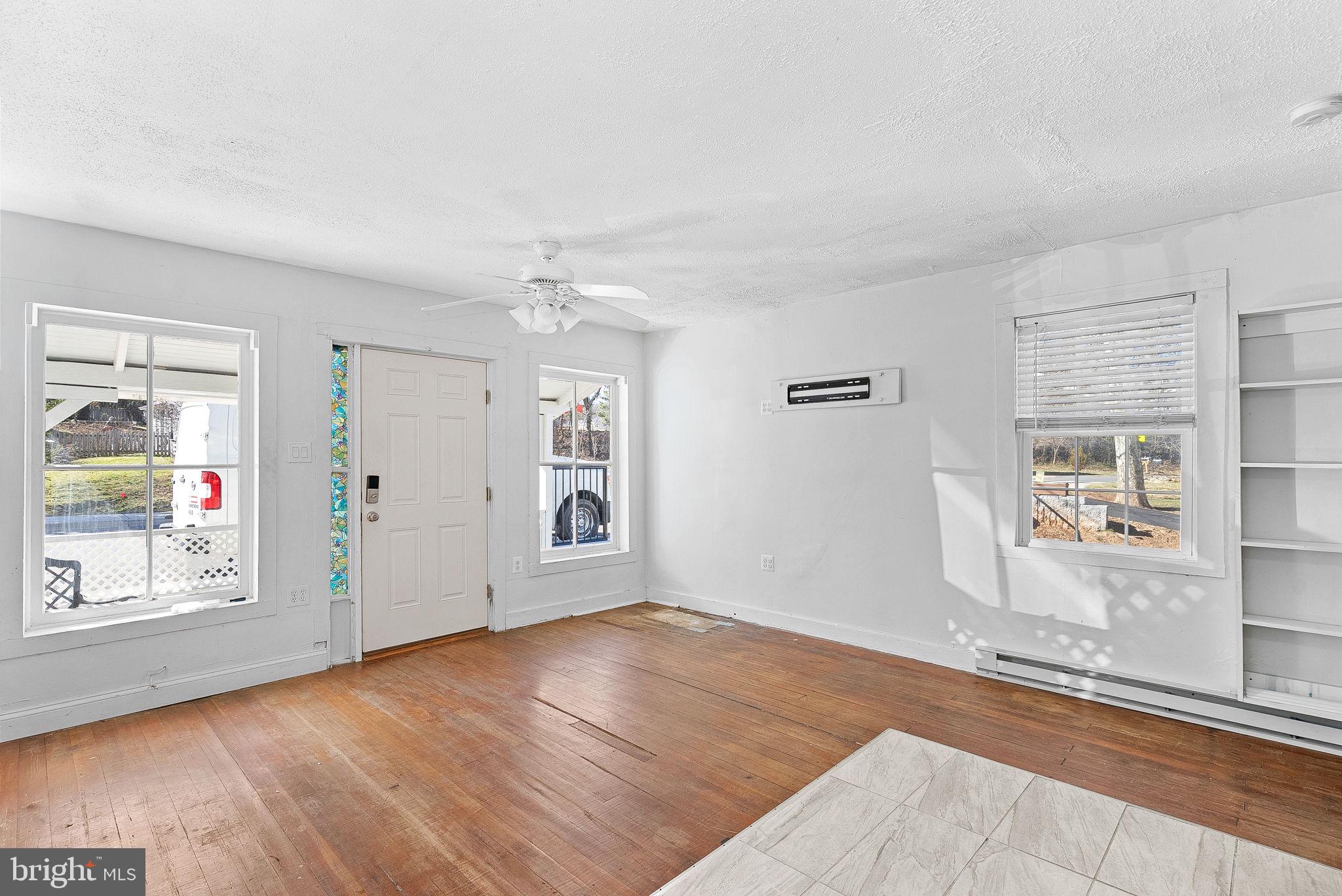31 Main Street Round Hill, VA 20141 - Photo 26 of 35 wooden floor in an empty room with a window