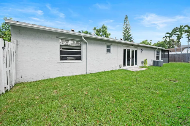 a backyard of a house with lots of green space