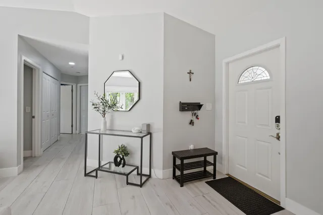 a view of a livingroom with furniture and wooden floor
