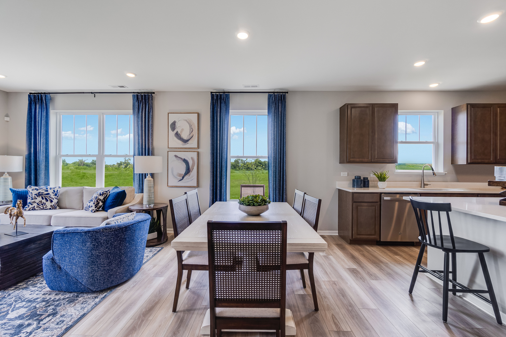 4245 Meadowridge Road Woodstock, IL 60098 - Photo 11 of 21 a living room with furniture a wooden floor and a large window