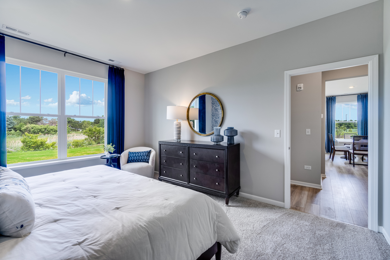 4245 Meadowridge Road Woodstock, IL 60098 - Photo 13 of 21 a bedroom with a bed and a dresser next to a window