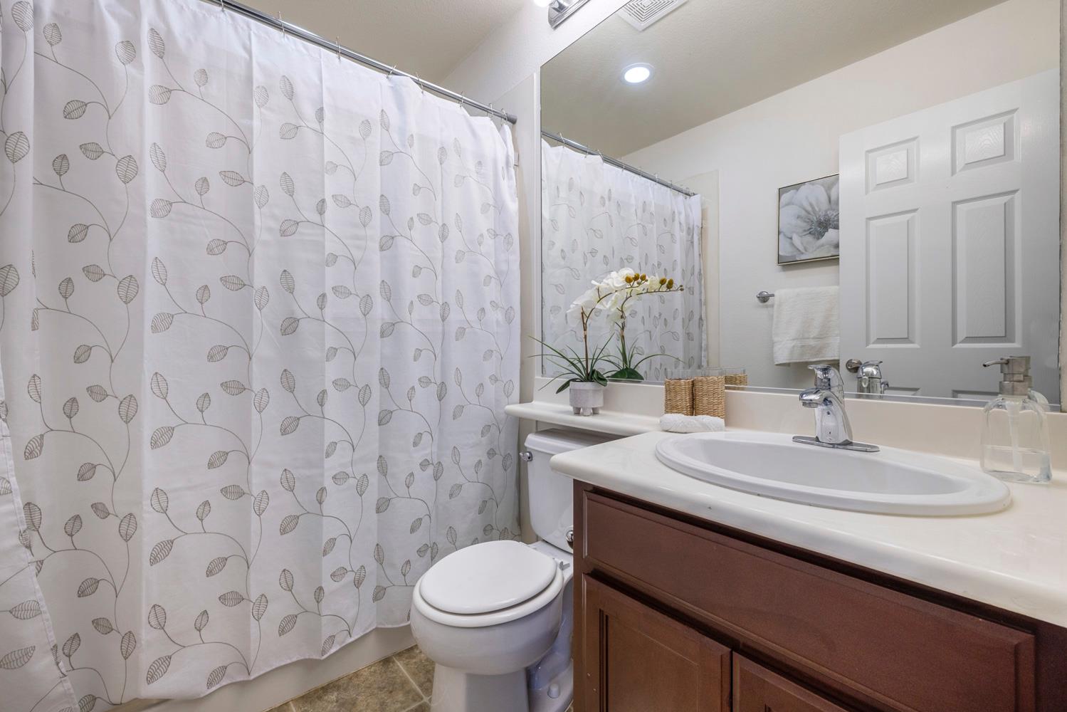 481 Keys Court Tracy, CA 95377 - Photo 17 of 45 a bathroom with a sink and a toilet