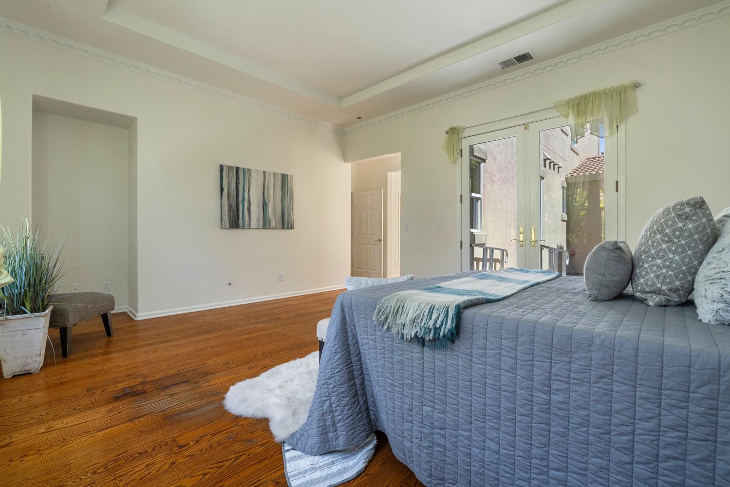 481 Keys Court Tracy, CA 95377 - Photo 20 of 45 a bedroom with a bed and wooden floor