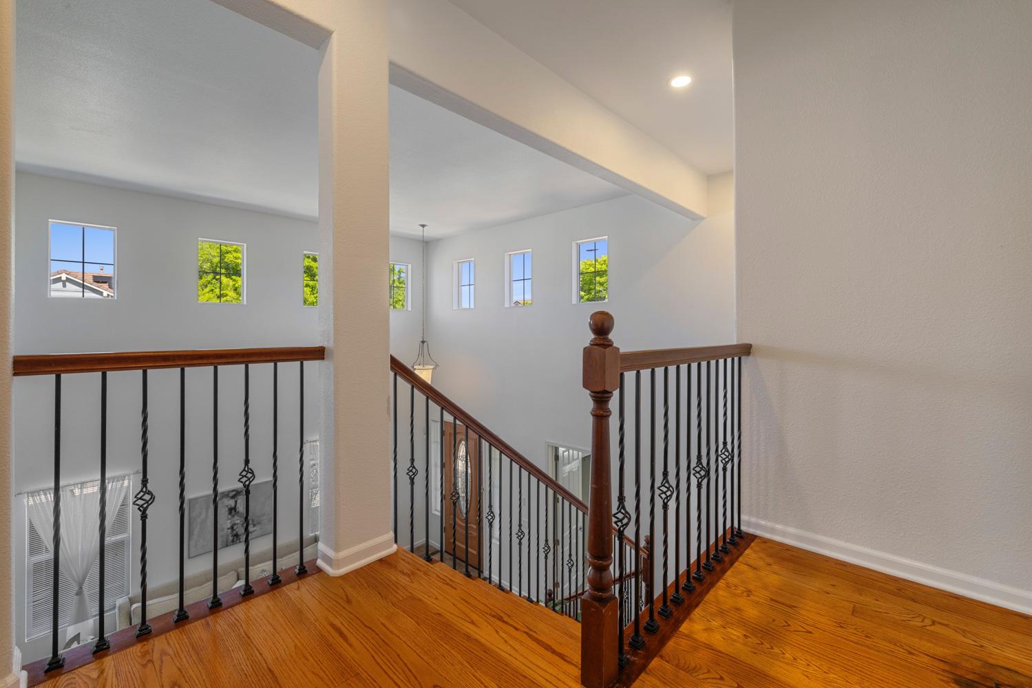 481 Keys Court Tracy, CA 95377 - Photo 25 of 45 a view of a hallway with wooden floor and stairs