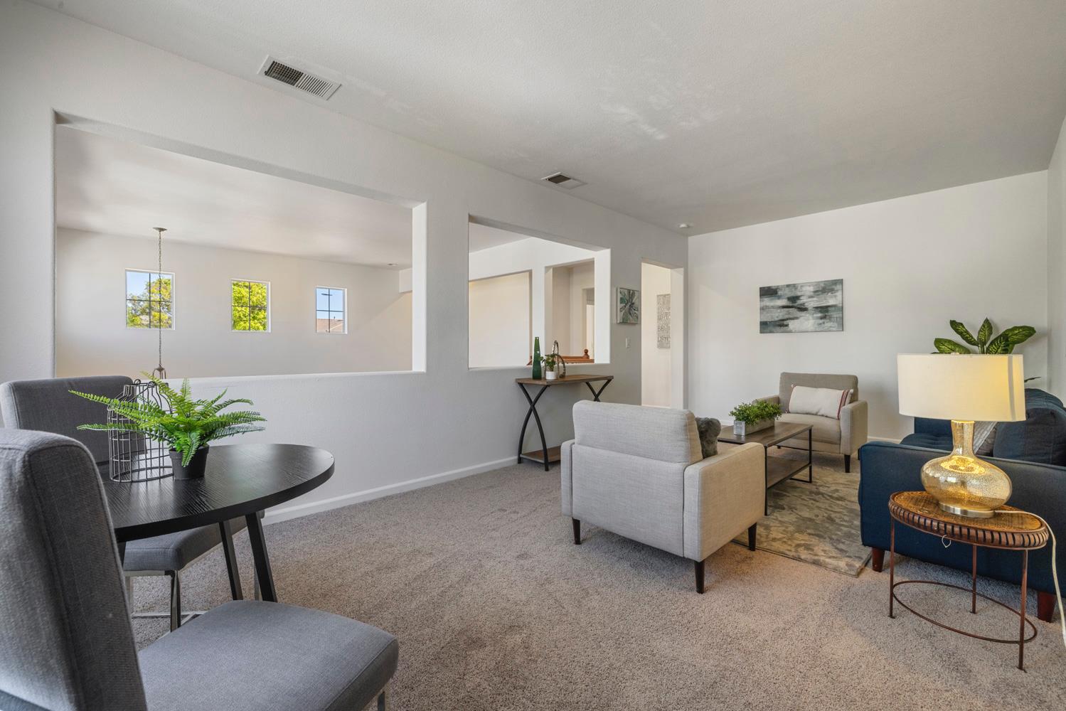 481 Keys Court Tracy, CA 95377 - Photo 27 of 45 a living room with furniture and a potted plant