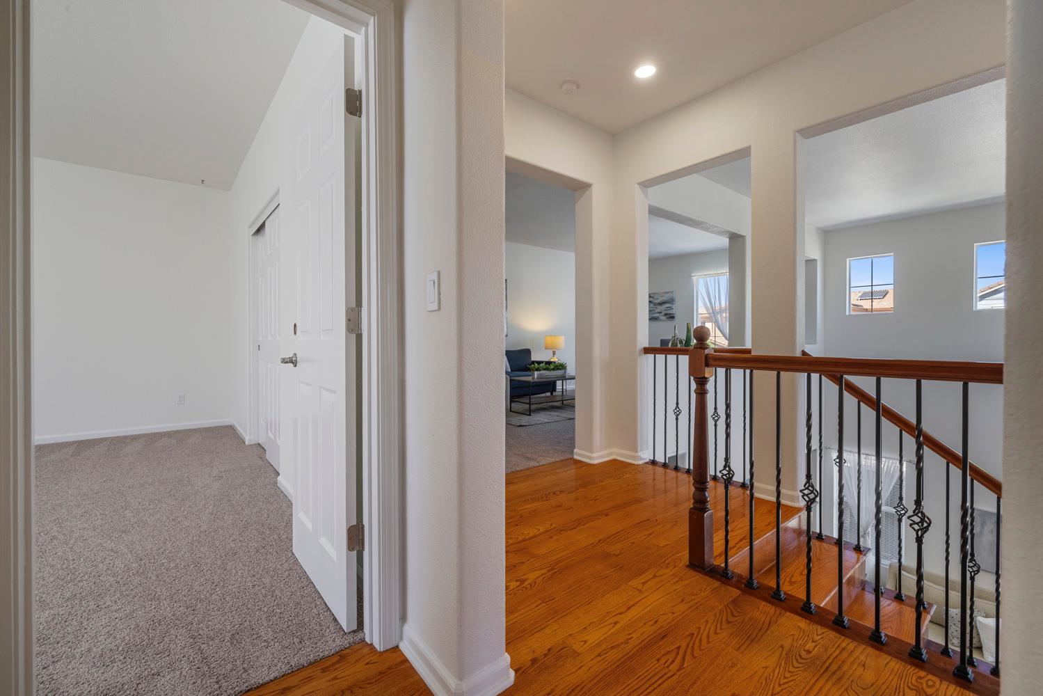 481 Keys Court Tracy, CA 95377 - Photo 30 of 45 a view of a hallway with wooden floor and a living room