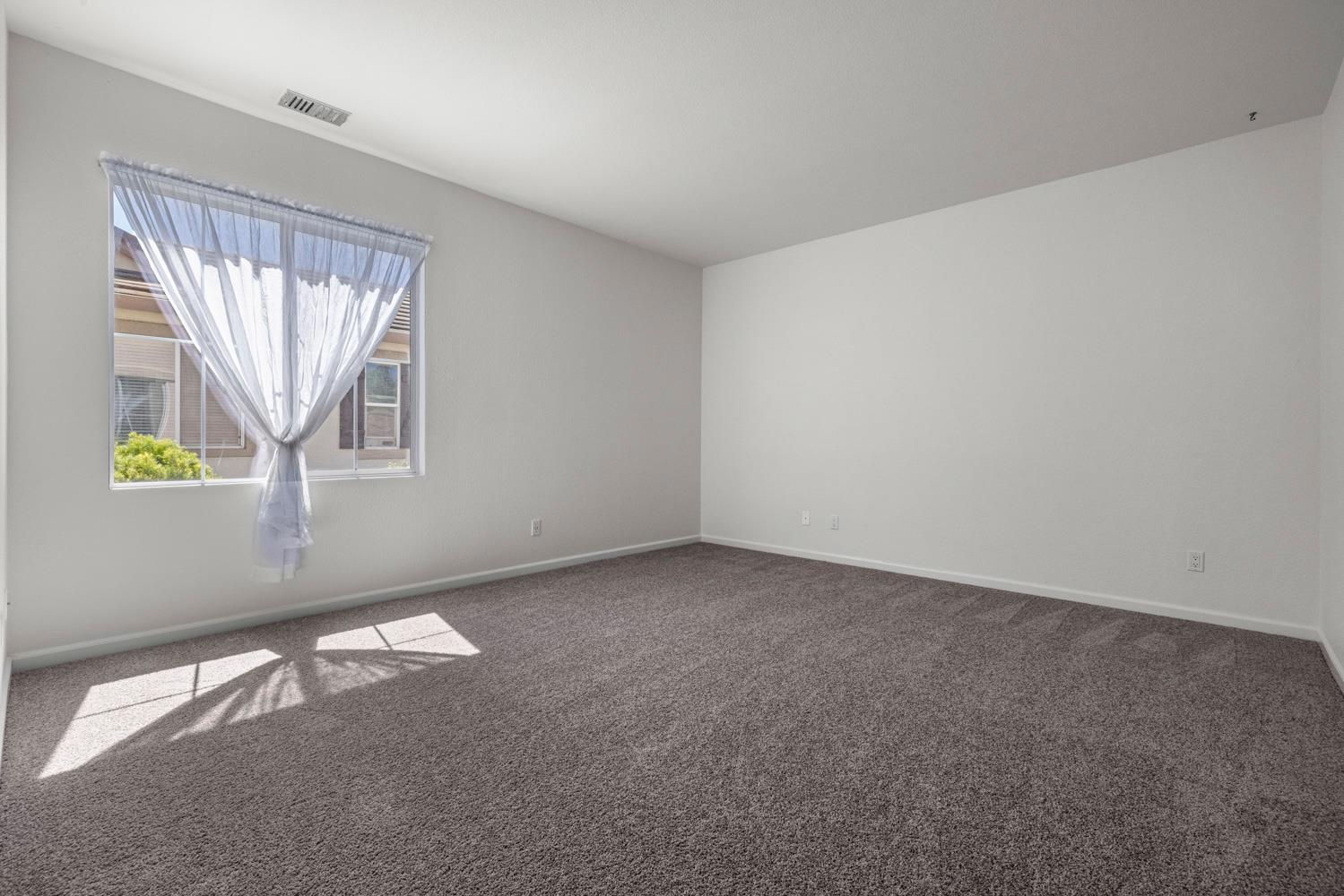 481 Keys Court Tracy, CA 95377 - Photo 31 of 45 an empty room with windows