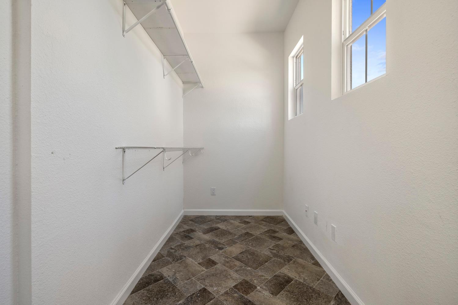 481 Keys Court Tracy, CA 95377 - Photo 36 of 45 a view of a room with racks on the wall