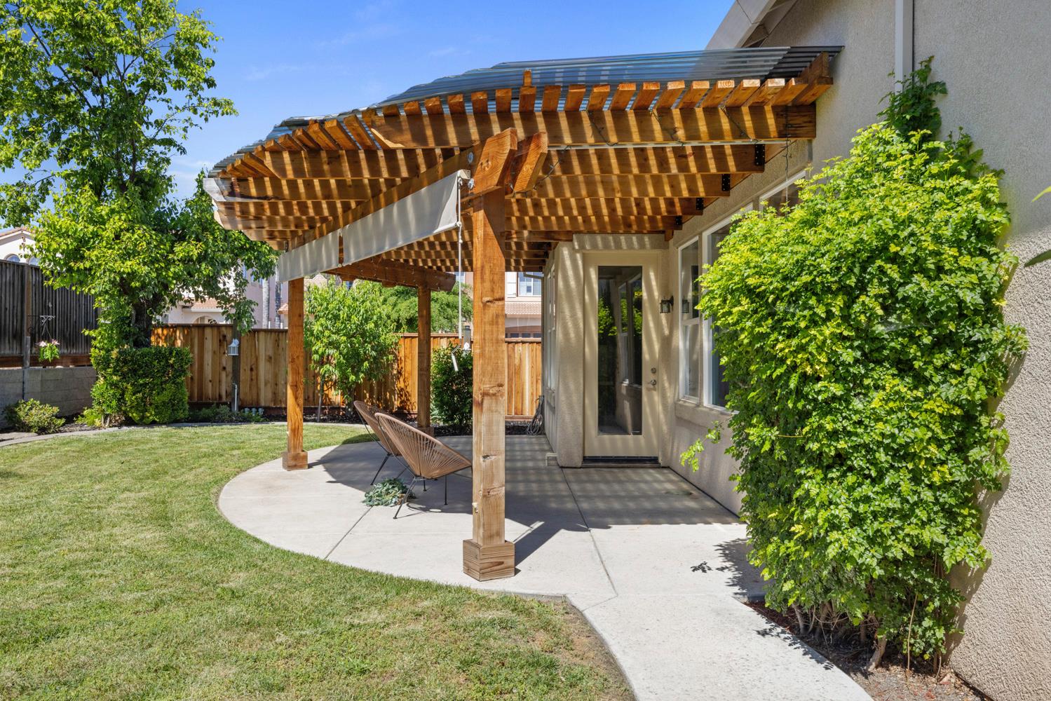 481 Keys Court Tracy, CA 95377 - Photo 44 of 45 a view of a backyard with potted plants