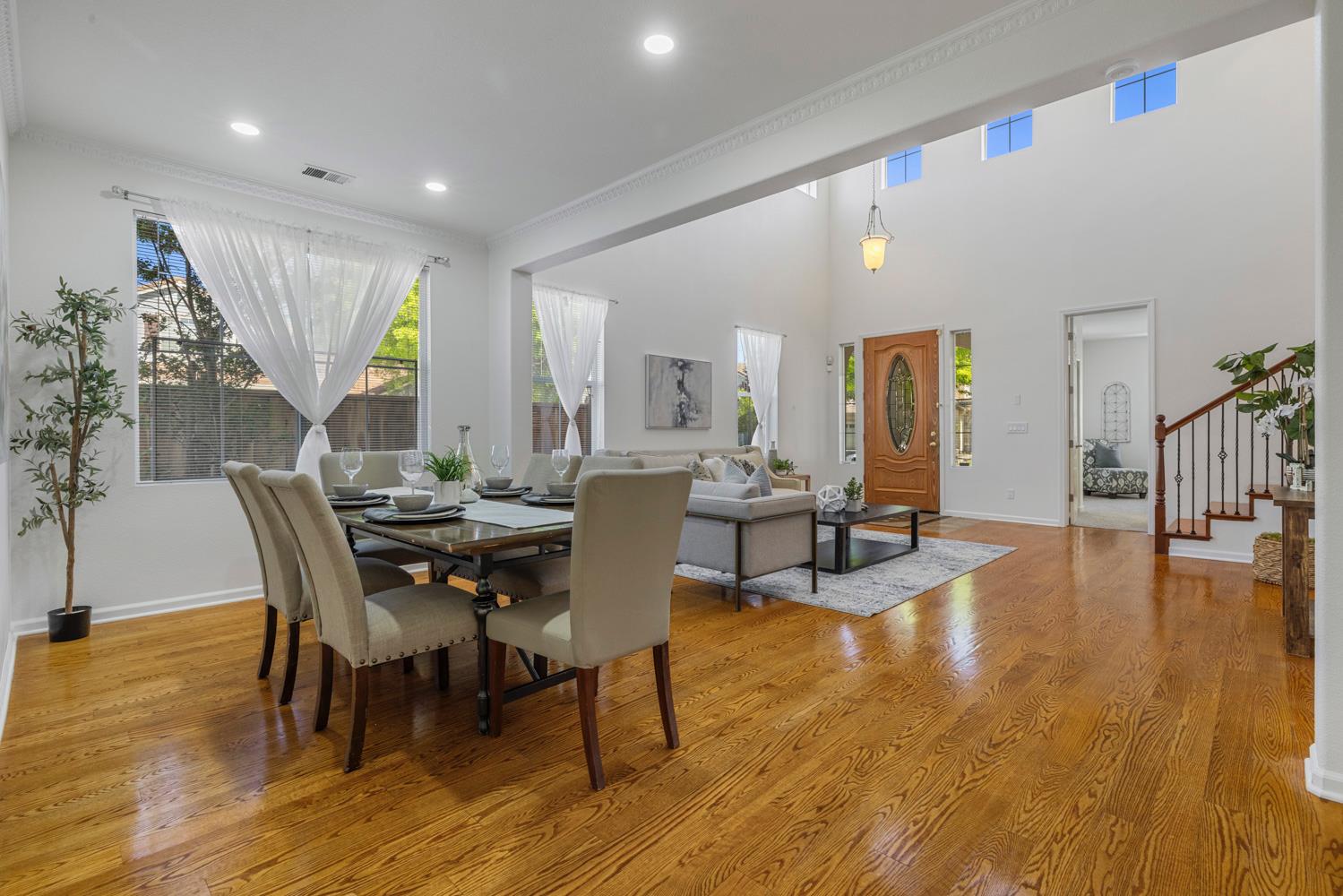 481 Keys Court Tracy, CA 95377 - Photo 5 of 45 a view of a dining room with furniture and wooden floor