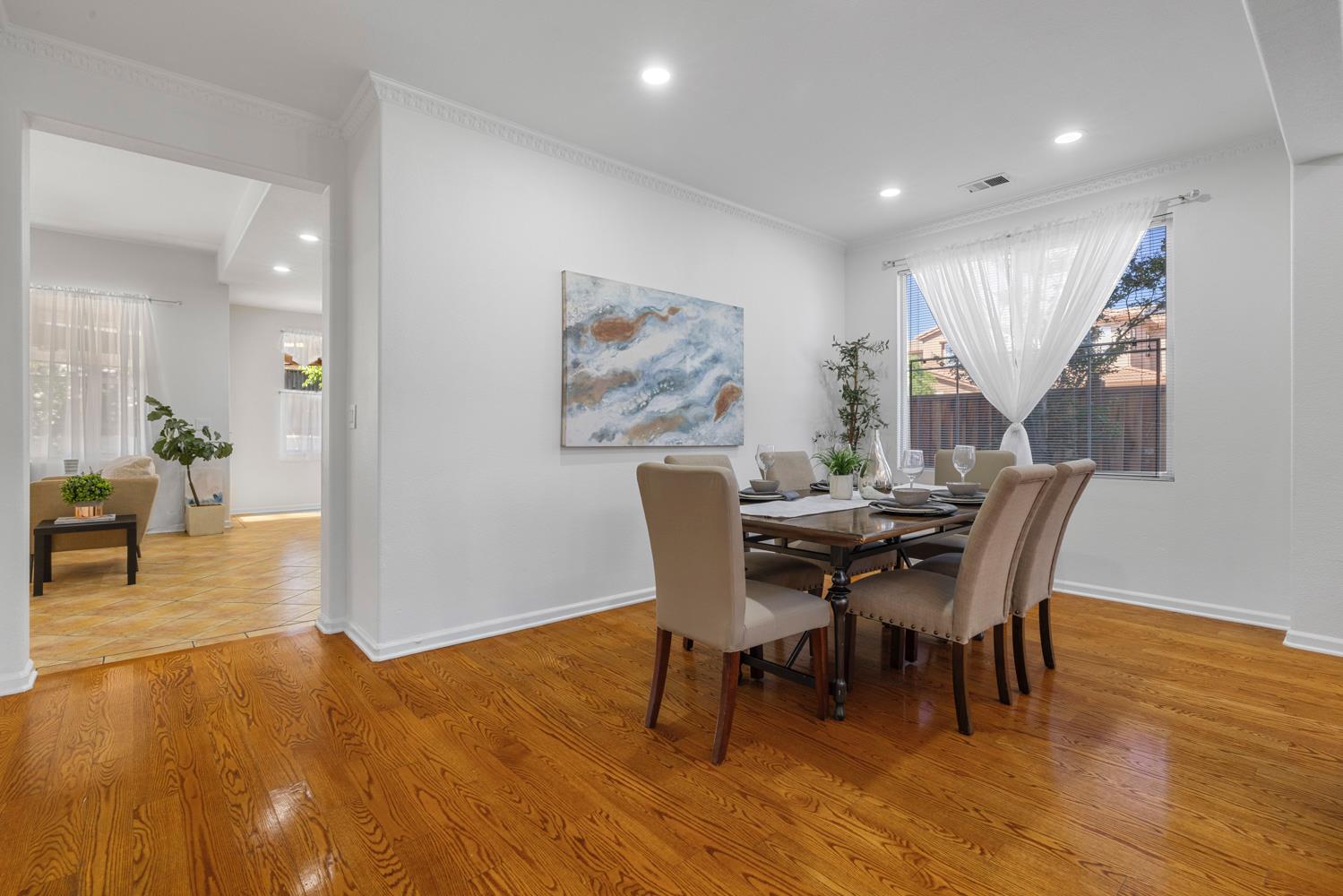 481 Keys Court Tracy, CA 95377 - Photo 6 of 45 a dining room with furniture and wooden floor