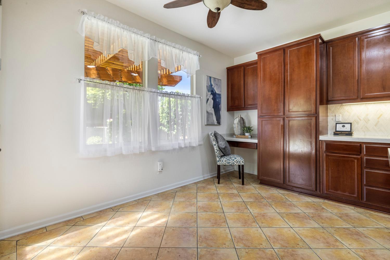 481 Keys Court Tracy, CA 95377 - Photo 9 of 45 a view of a refrigerator in kitchen and an empty room