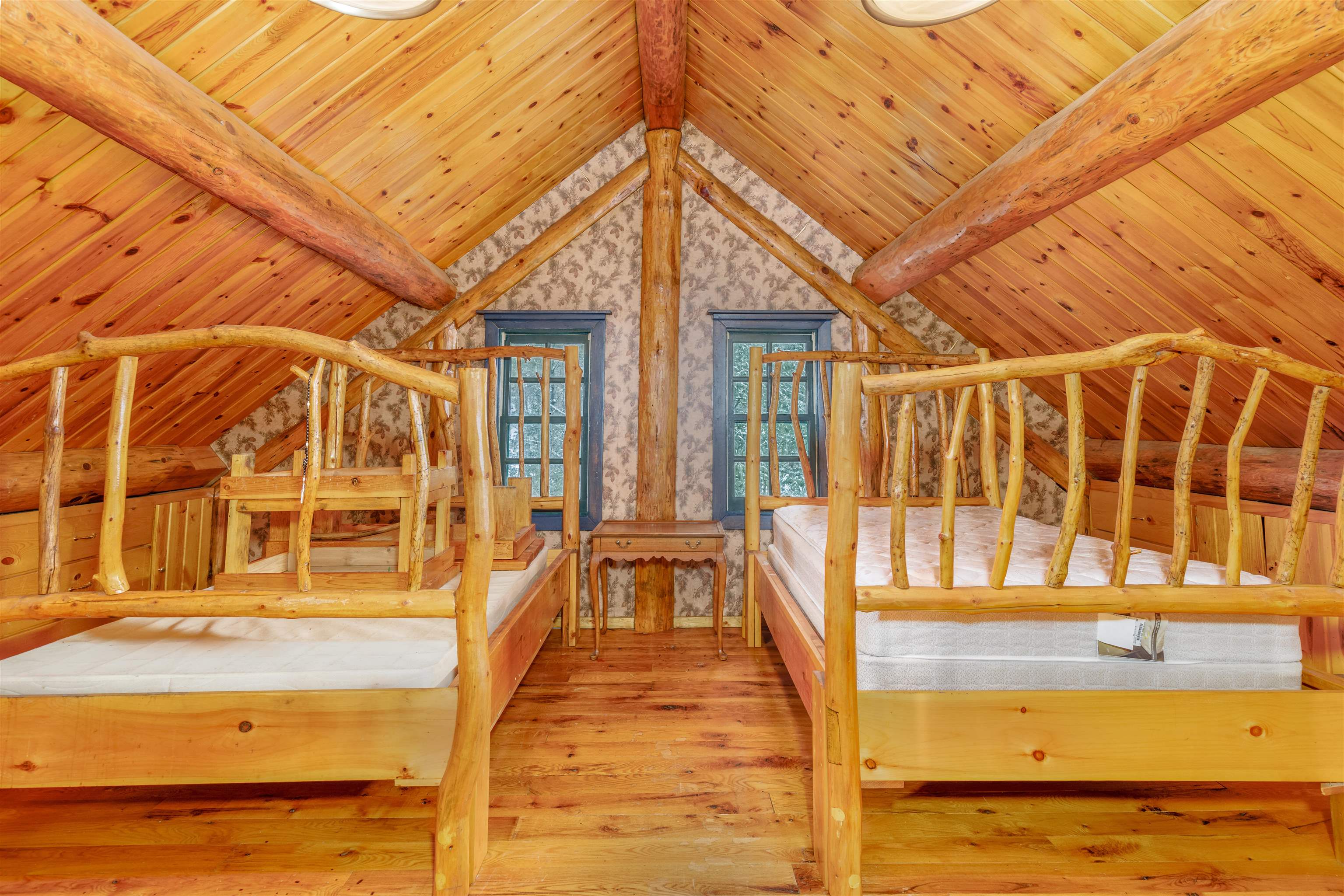 3547 Norway Lane Ely, MN 55731 - Photo 11 of 31 Unfurnished bedroom featuring hardwood / wood-style floors, vaulted ceiling with beams, and wooden ceiling