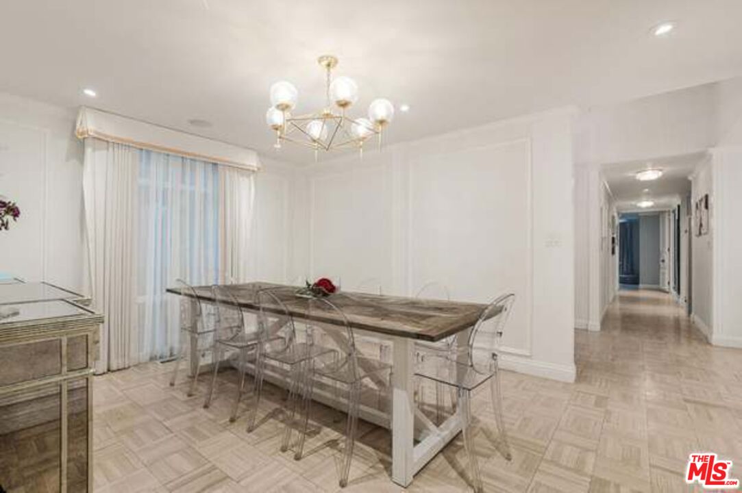 936 Chantilly Road Los Angeles, CA 90077 - Photo 7 of 25 a view of a room with chandelier fan and windows