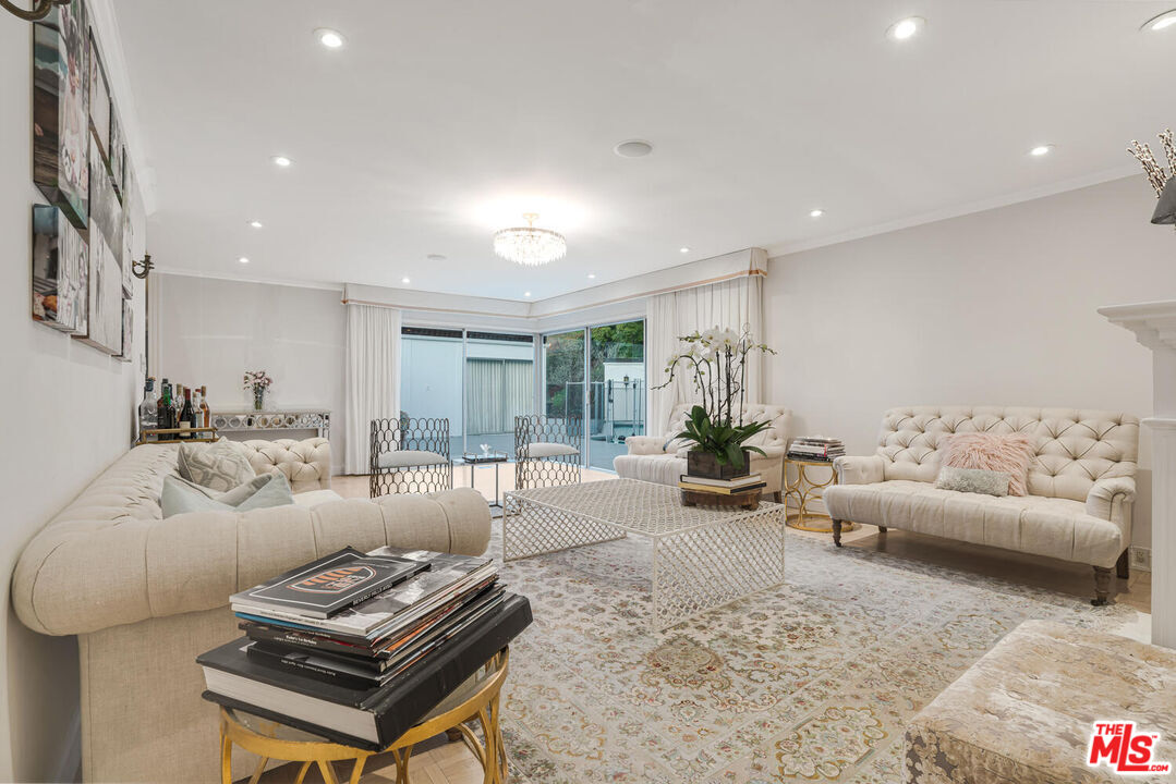 936 Chantilly Road Los Angeles, CA 90077 - Photo 9 of 25 a living room with furniture and a couch