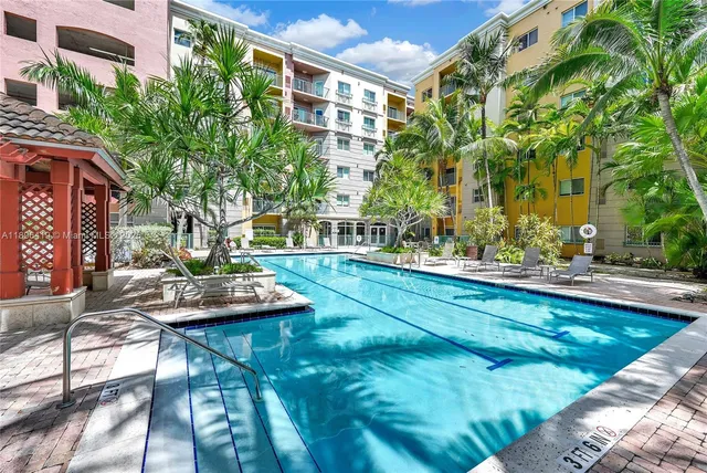 a view of house with swimming pool outdoor seating