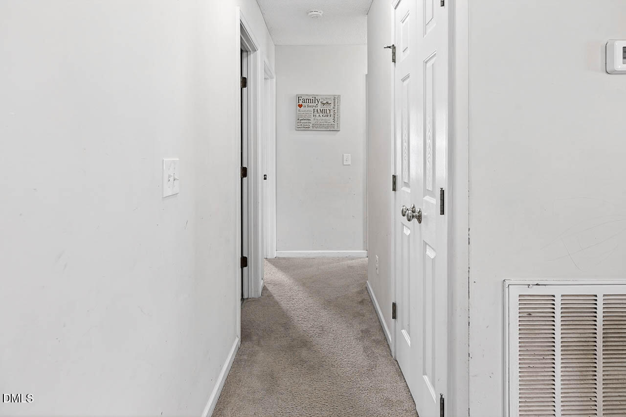6668 Beaver Ridge Court Snow Camp, NC 27349 - Photo 24 of 38 a view of a hallway with a elevator