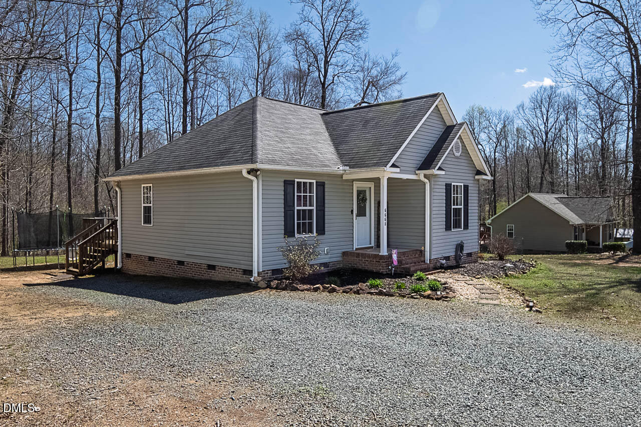 6668 Beaver Ridge Court Snow Camp, NC 27349 - Photo 5 of 38 a view of a house with backyard