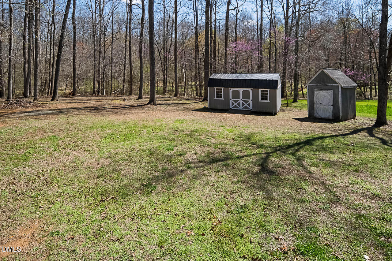 6668 Beaver Ridge Court Snow Camp, NC 27349 - Photo 8 of 38 a view of house with backyard and outdoor space