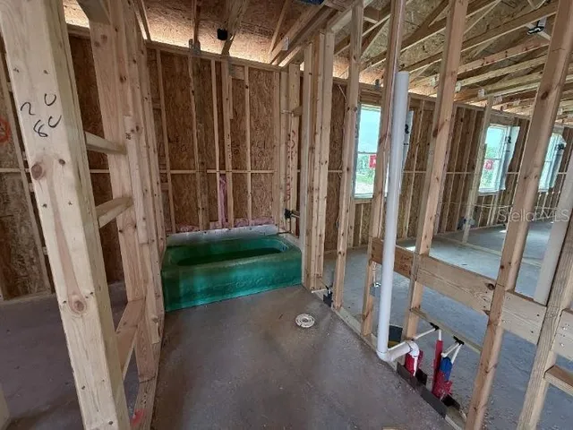 a view of an empty room with stairs