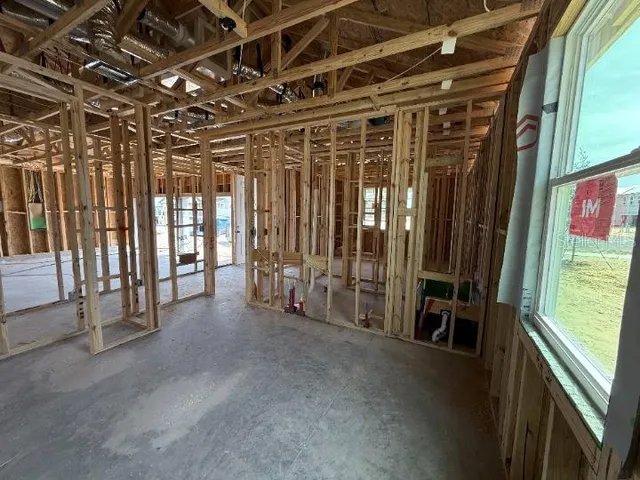 a view of empty room with wooden walls