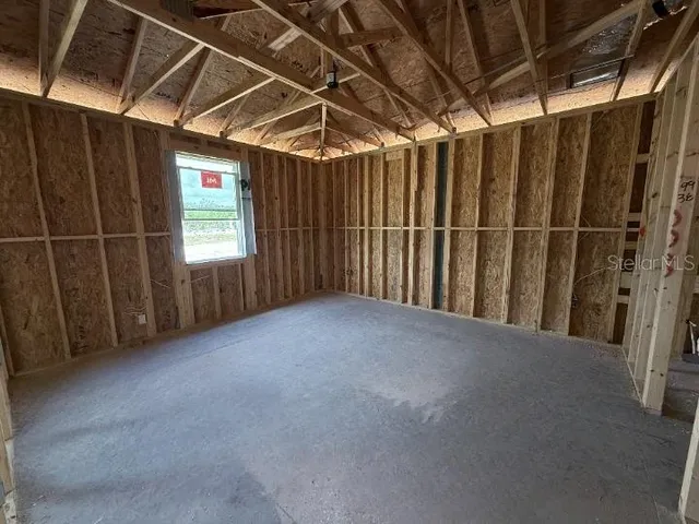 a view of an empty room with stairs