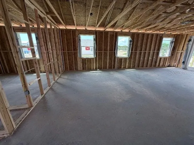 a view of a hall with wooden floor