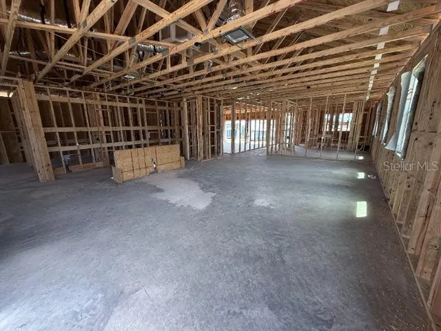 a view of an empty room with windows