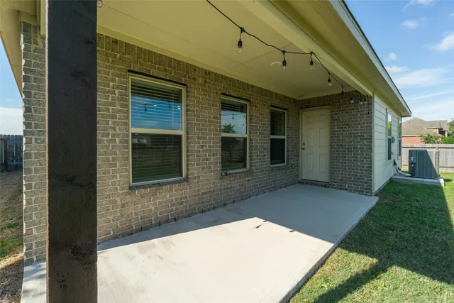 a view of house with backyard
