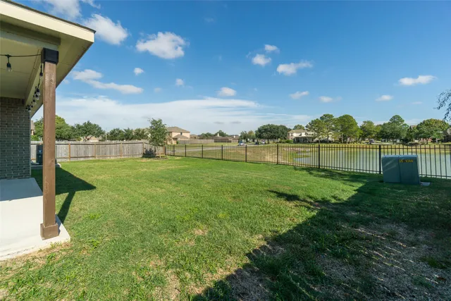 a view of a lake with a big yard