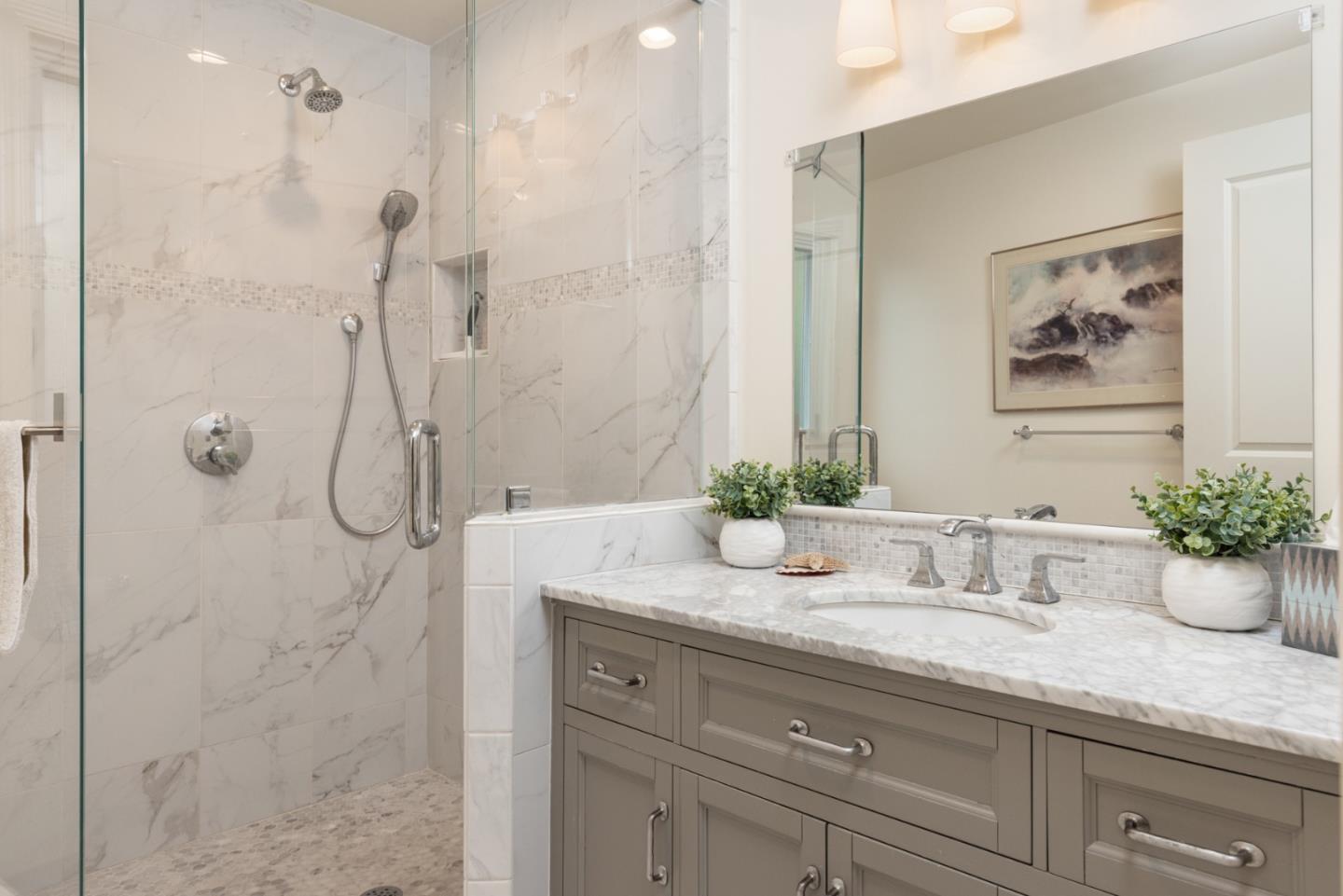 26177 Scenic Road Carmel, CA 93923 - Photo 21 of 30 a bathroom with a granite countertop sink a mirror and shower