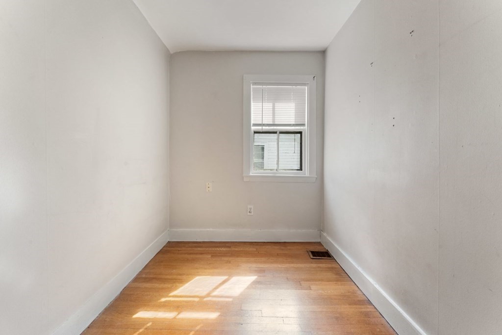 24 School Street Newton, MA 02458 - Photo 13 of 13 an empty room with a window