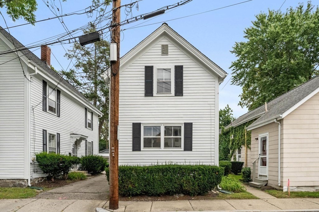24 School Street Newton, MA 02458 - Photo 2 of 13 a view of a house with a yard and plants
