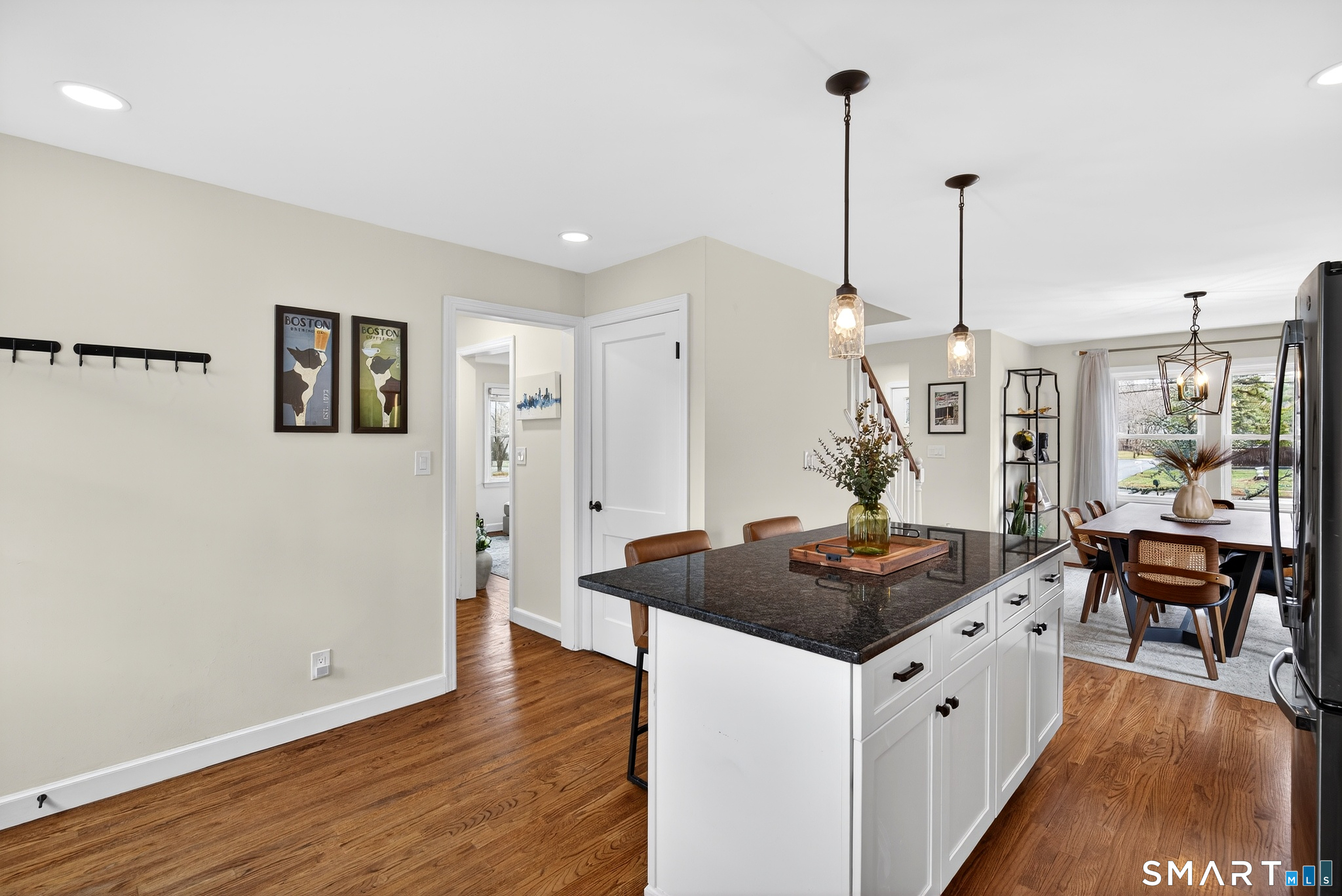 45 Walnut Street Milford, CT 06461 - Photo 18 of 39 a kitchen with stainless steel appliances granite countertop a refrigerator a sink dishwasher and a stove with wooden floor