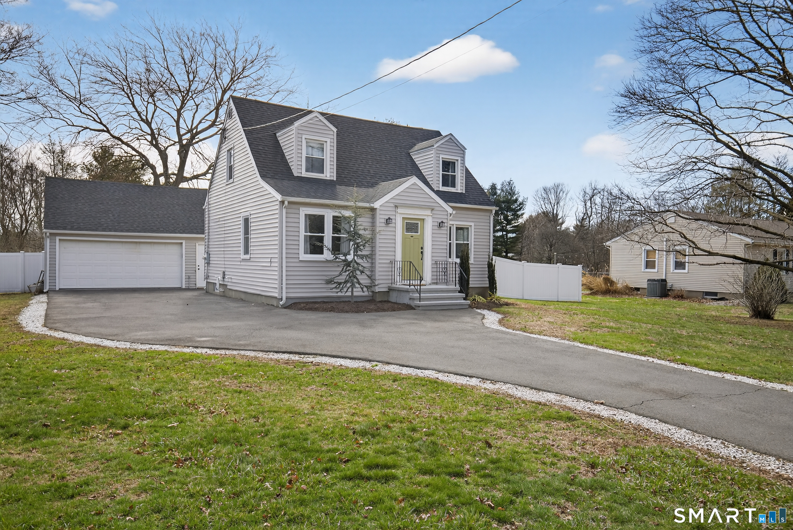 45 Walnut Street Milford, CT 06461 - Photo 2 of 39 a front view of a house with garden