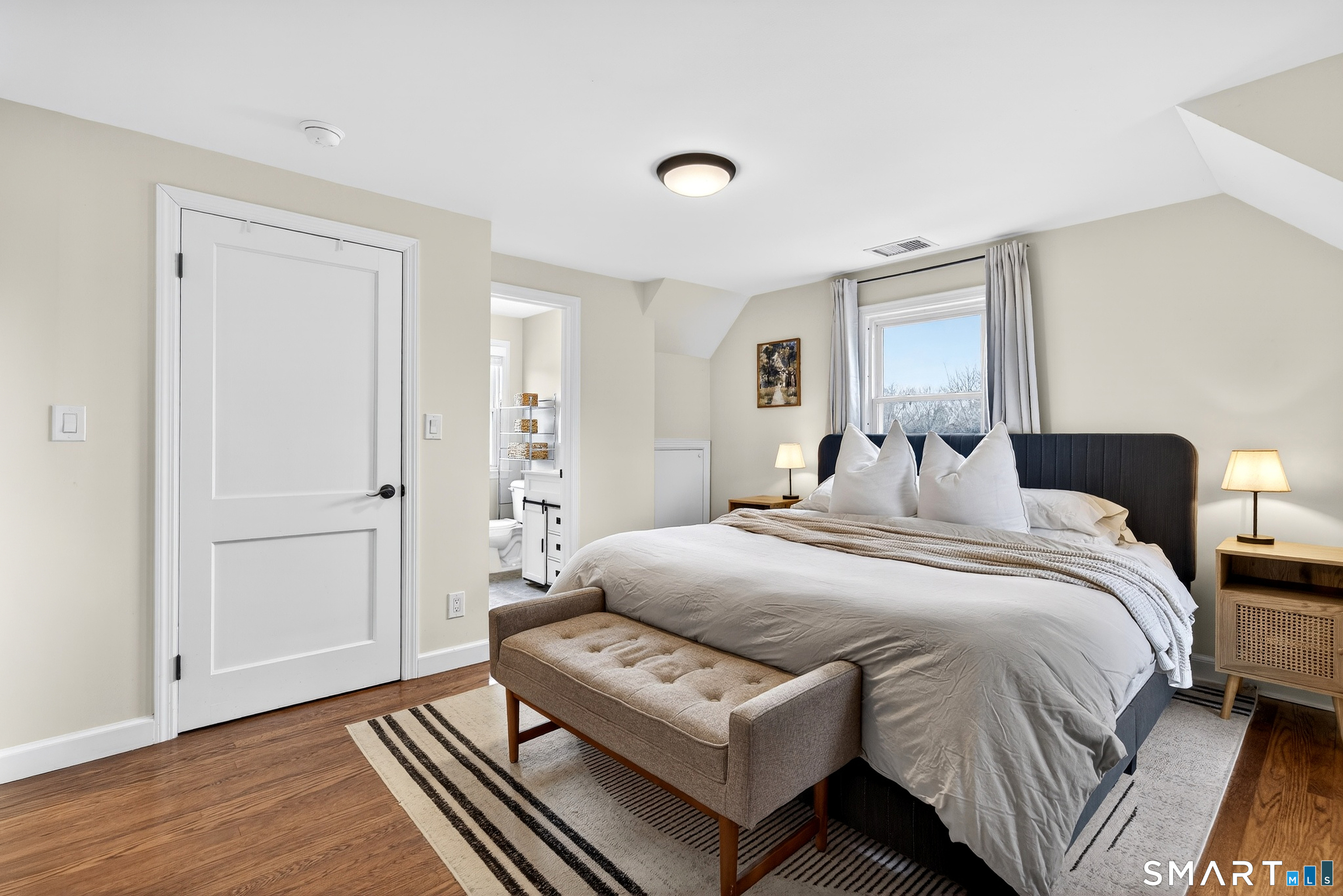 45 Walnut Street Milford, CT 06461 - Photo 22 of 39 a bedroom with a bed and a couch