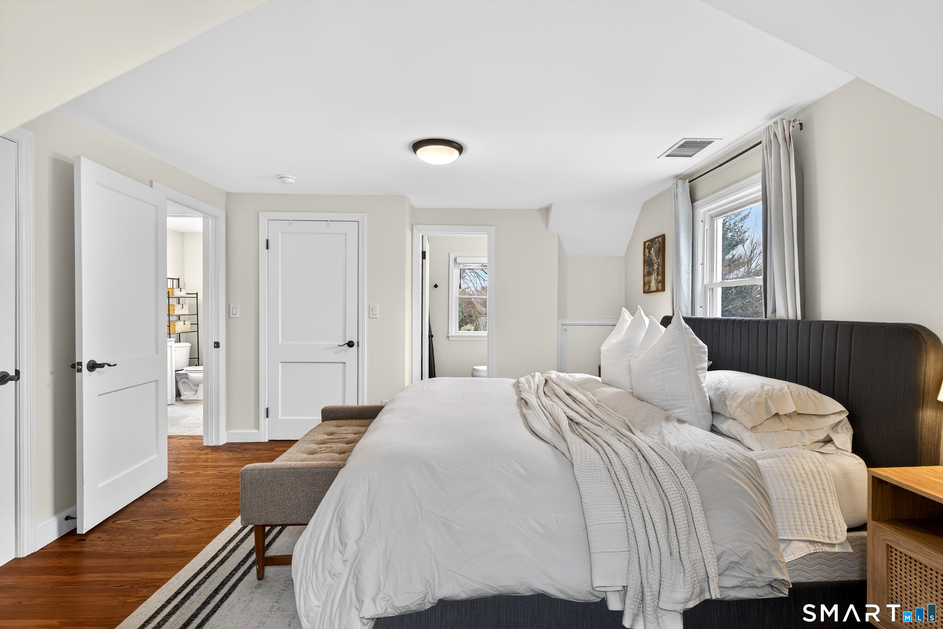 45 Walnut Street Milford, CT 06461 - Photo 23 of 39 a bedroom with a bed and a couch