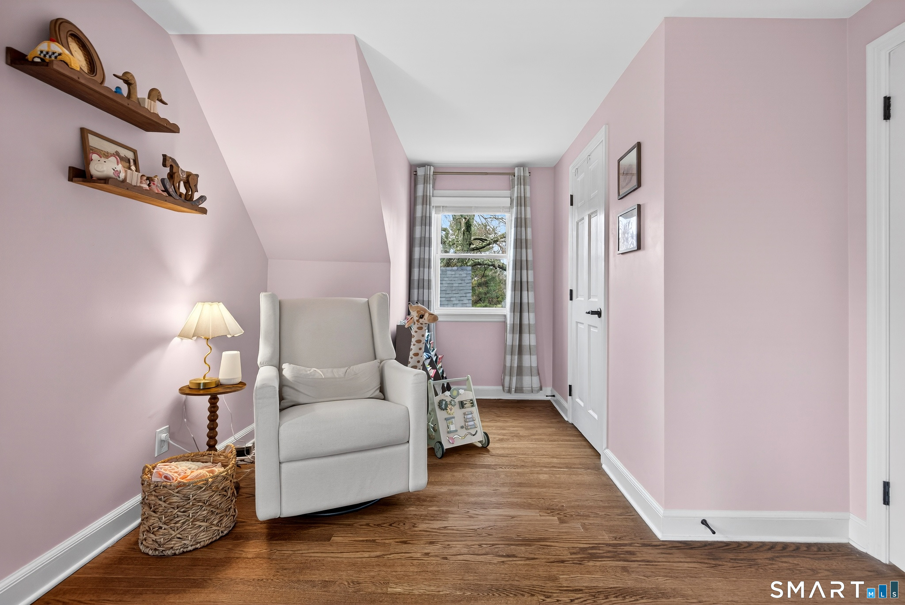 45 Walnut Street Milford, CT 06461 - Photo 27 of 39 a living room with furniture and a wooden floor