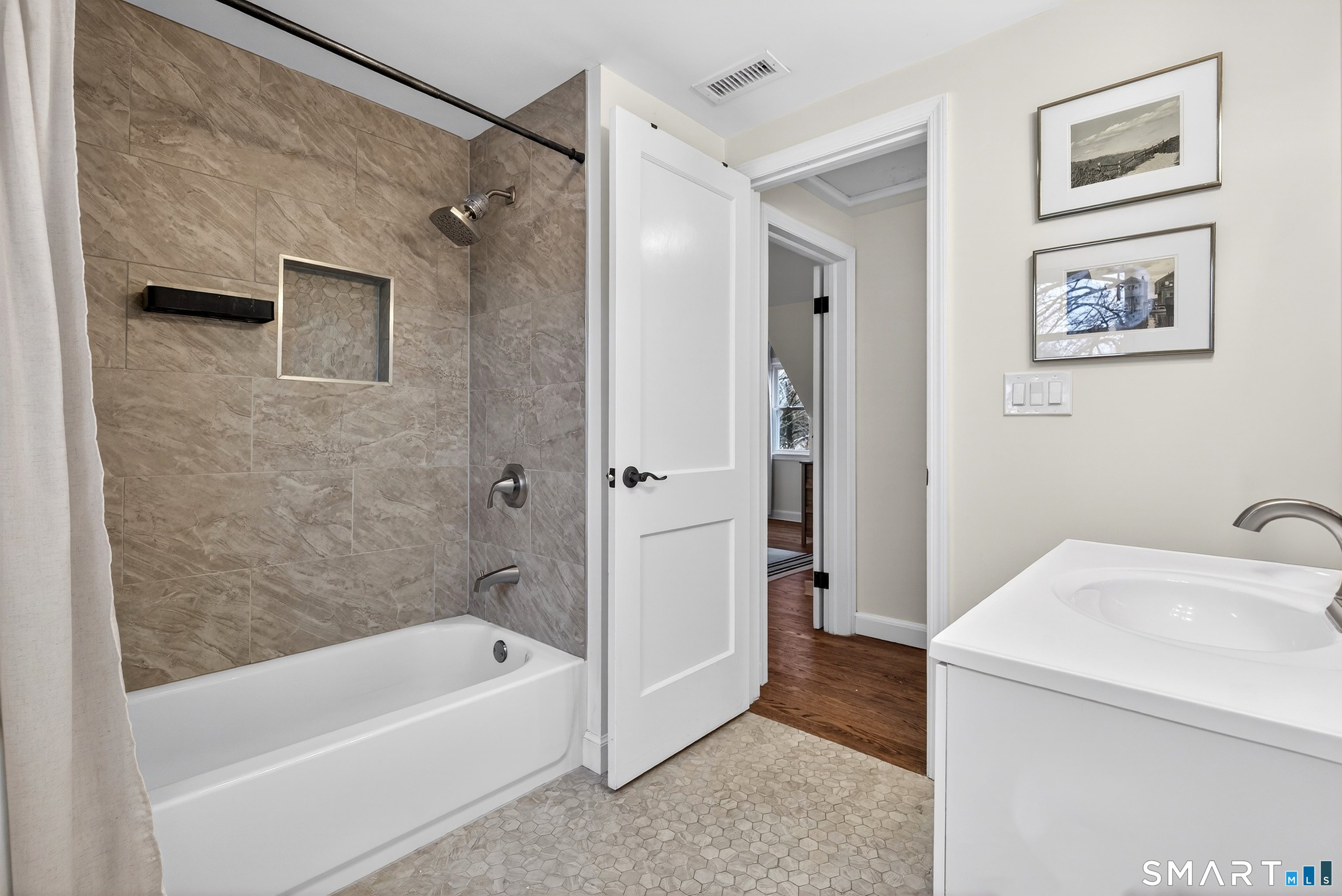 45 Walnut Street Milford, CT 06461 - Photo 29 of 39 a bathroom with a tub a sink and a shower