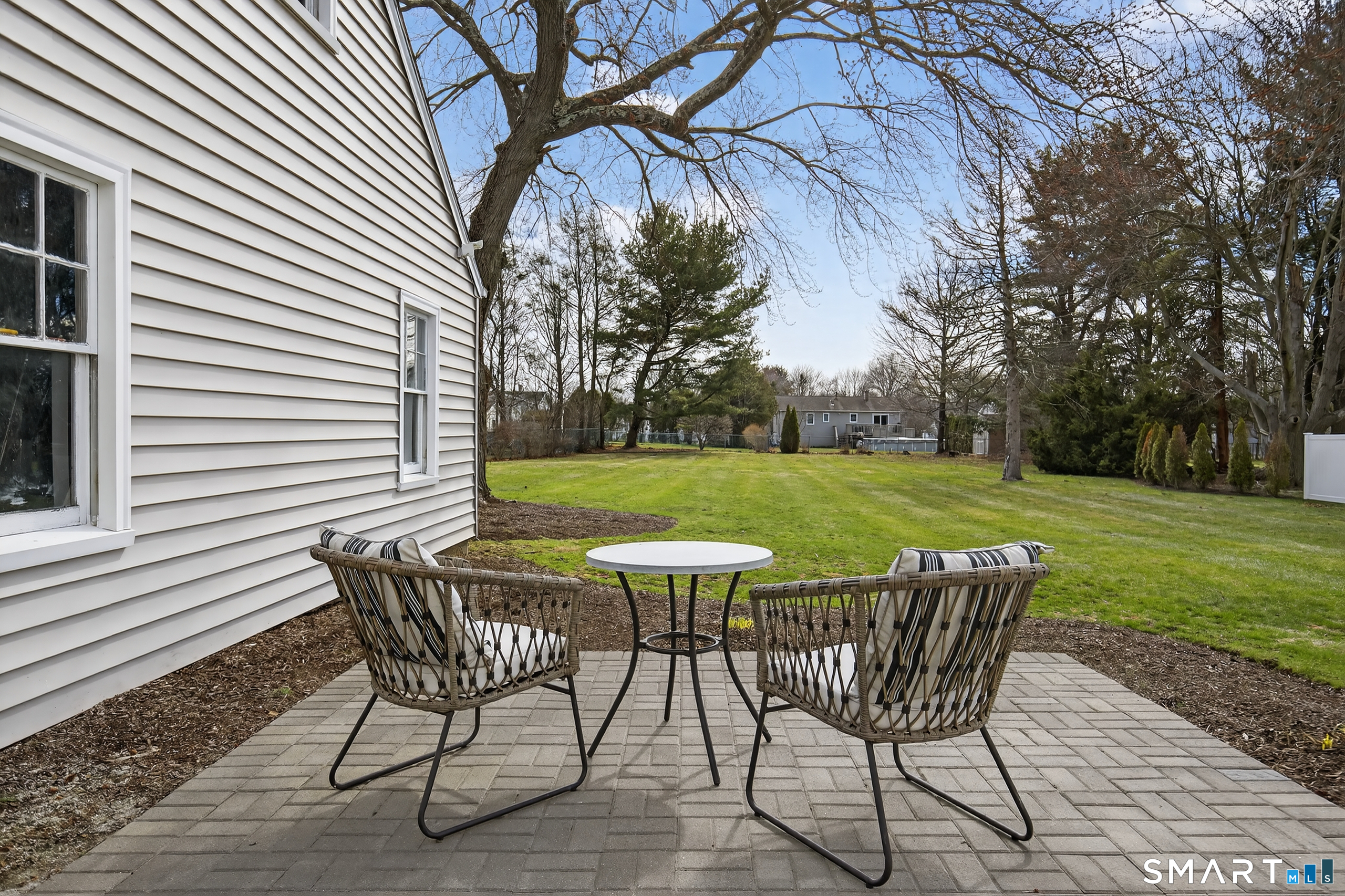 45 Walnut Street Milford, CT 06461 - Photo 30 of 39 a view of a table and chairs in backyard of the house