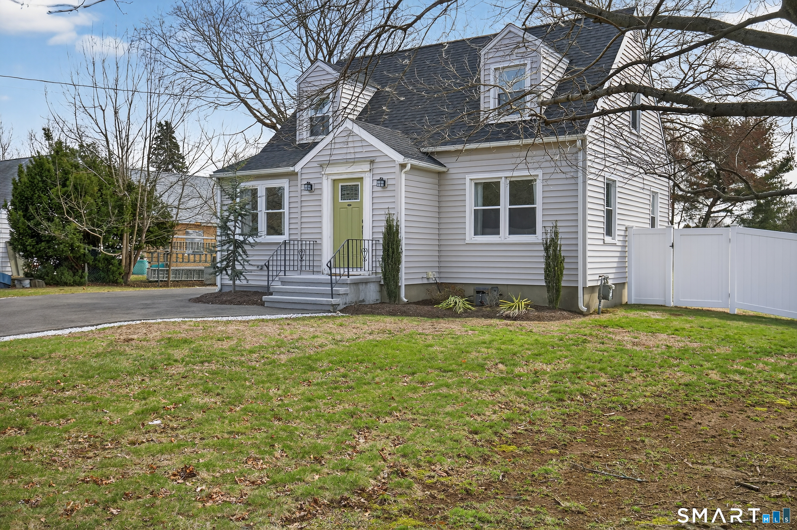 45 Walnut Street Milford, CT 06461 - Photo 3 of 39 a front view of house with yard and outdoor seating