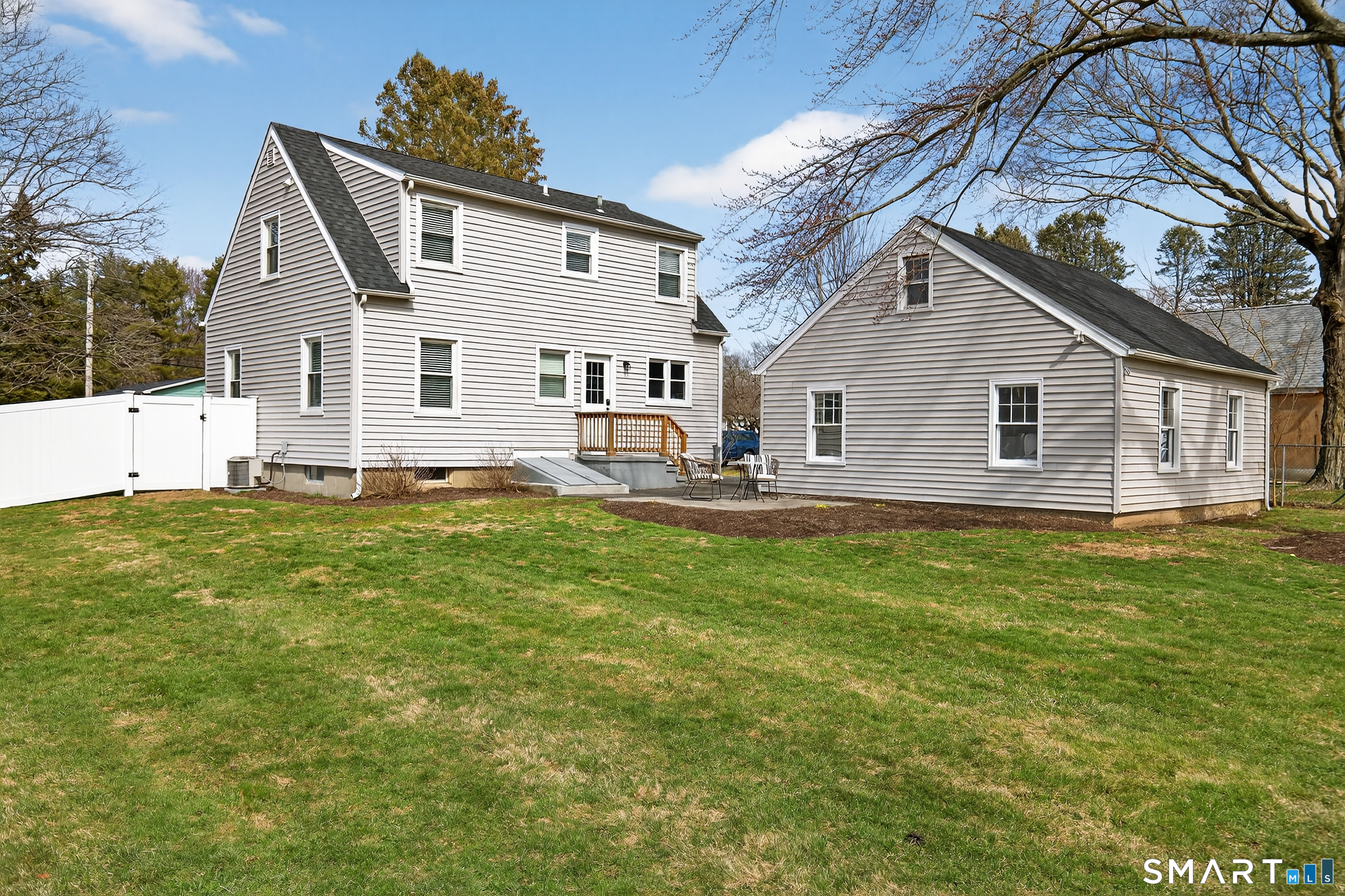 45 Walnut Street Milford, CT 06461 - Photo 31 of 39 a view of a house with a backyard