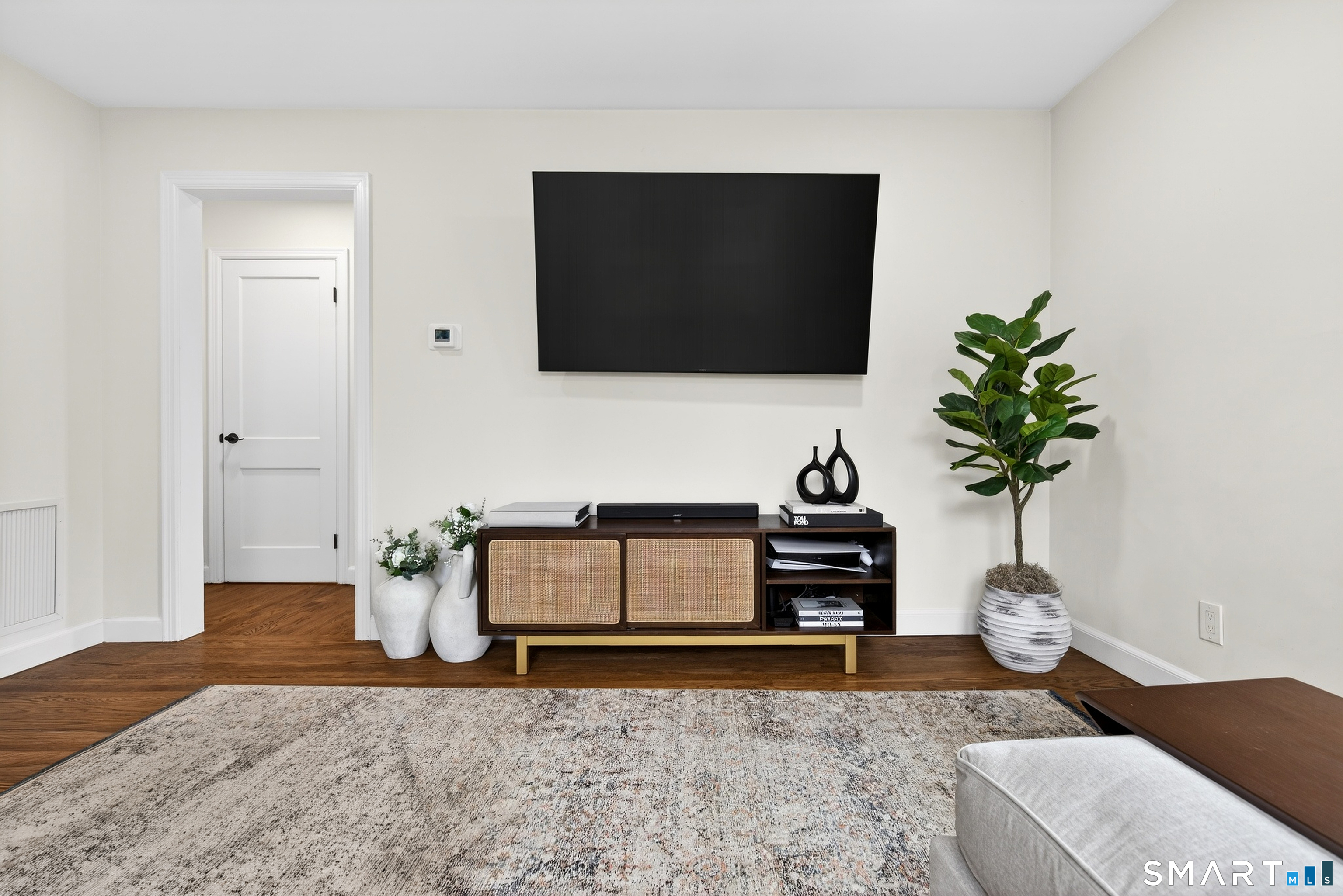 45 Walnut Street Milford, CT 06461 - Photo 7 of 39 a living room with furniture and a flat screen tv